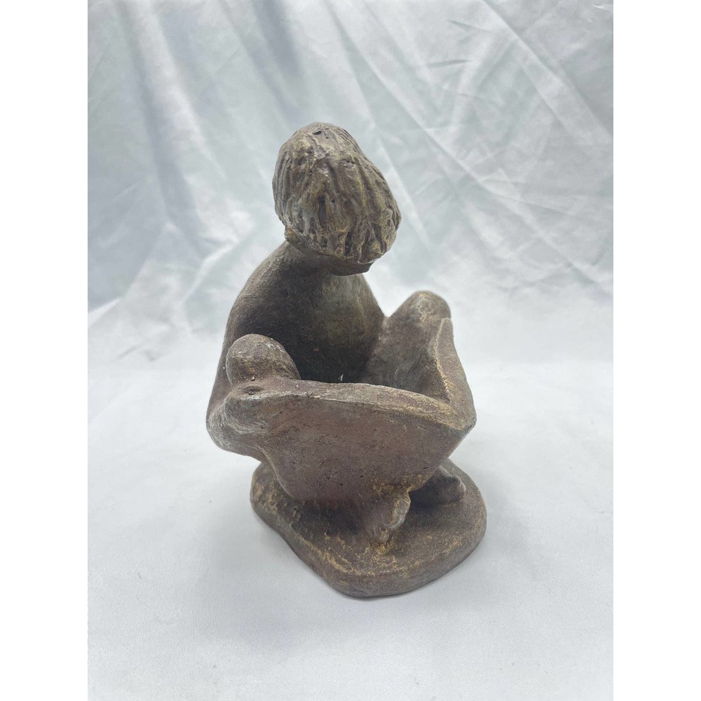 VTG Austin Productions reading boy sculpture